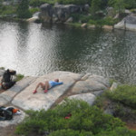 Enjoying the Sierra Nevada sun by an alpine lake