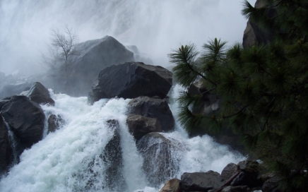 cascading water in rocks below falls